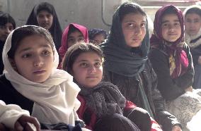Afghan girls study at school